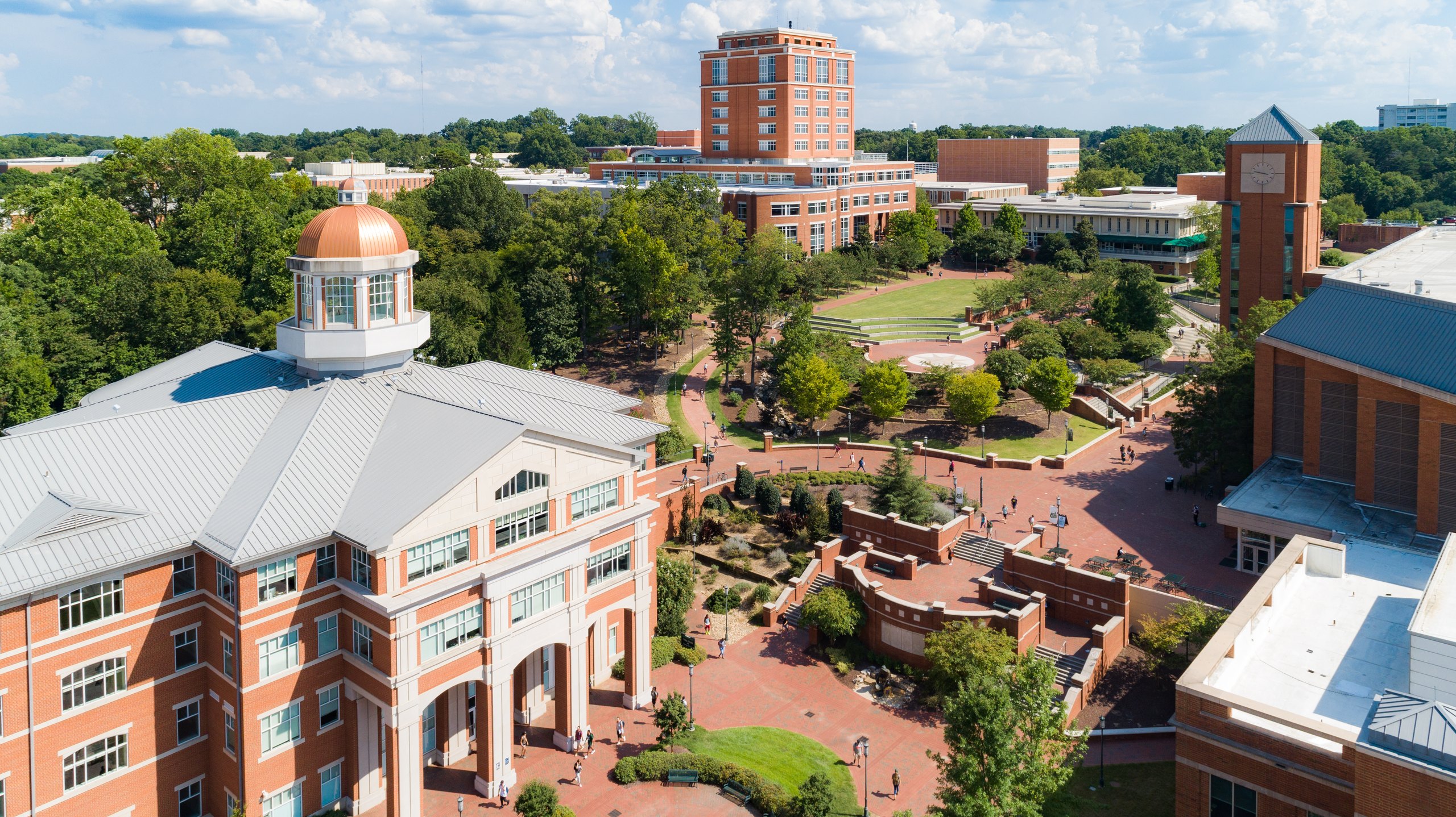 Aerial view of UNC Charlotte's main campus and Atkins Library clock tower