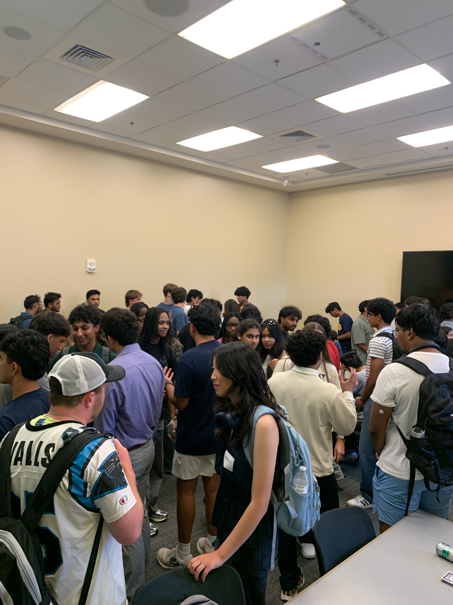 Students meeting and speaking with one another at UNC Charlotte